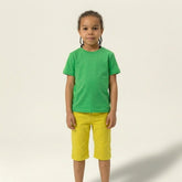 Front view of a boy standing in a solid green cotton t-shirt, providing a perfect blank canvas for logo screen printing or embroidery